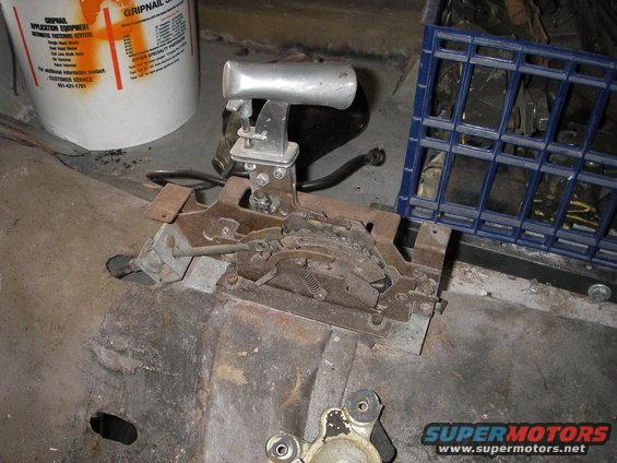 crapshifter.jpg out with the old & in with the new

a little cut-off wheel action along the welds holding the auto shifter mount plate on, followed by a pry bar and it's out of there 

then a grinder & flap wheel & it's like it never even happened