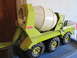 2004 Aston Martin Virage - A vintage Tonka cement mixer toy truck is shown from a three-quarter front view.