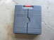 2004 Aston Martin Virage - Gray Husky tool case with red handle sits on a concrete surface.