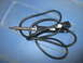 2004 Aston Martin Virage - A soldering iron with its power cord is shown against a blue background.