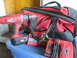 2004 Aston Martin Virage - Milwaukee cordless drill with battery, two chargers, and a tool bag are displayed on a blue bin.