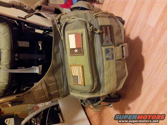Tactical backpack with Texas and US flag patches, and other insignia