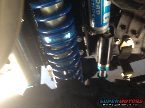 Blue coilover shock absorber with 'SHOCK' visible