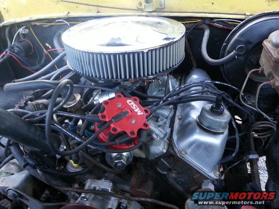Engine bay showing MSD ignition distributor, chrome air cleaner, and valve cover