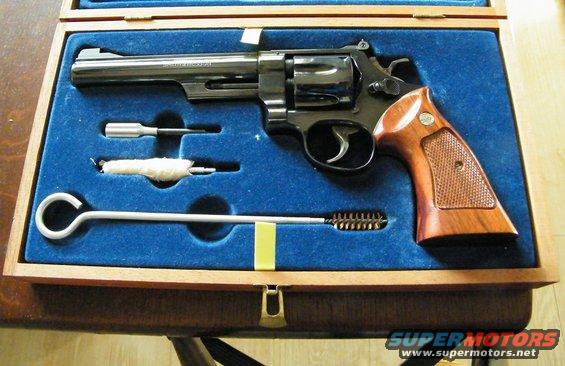 Revolver gun in a wooden case with cleaning tools