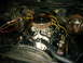 1975 Chevrolet Chevelle - Engine bay detail showing a V8 engine with aftermarket air cleaner and carburetor. No specific year can be determined from this view.