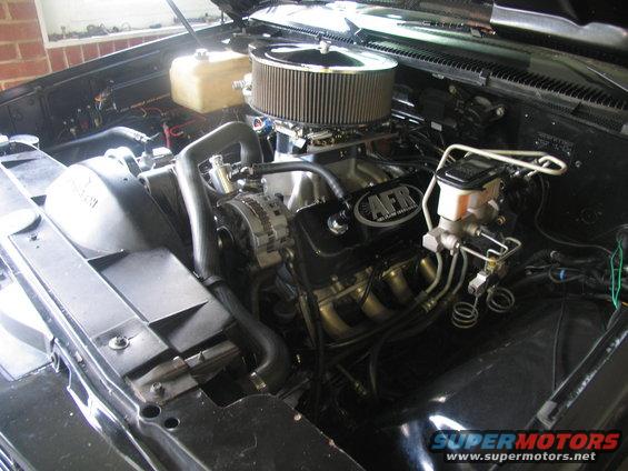 Black engine bay with AFR valve covers and a large air filter