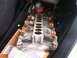 2003 Ford Crown Victoria - An intake manifold with eight orange-top fuel injectors is shown, likely a vehicle part.