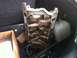 2003 Ford Crown Victoria - Engine intake manifold with visible carbon buildup, stored with other car parts.
