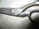 2004 Aston Martin Virage - A pair of scissors with the 'Arden' logo visible on the metal blade.
