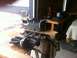 2003 Ford Crown Victoria - A supercharger and engine block are staged on sawhorses in a workshop setting.