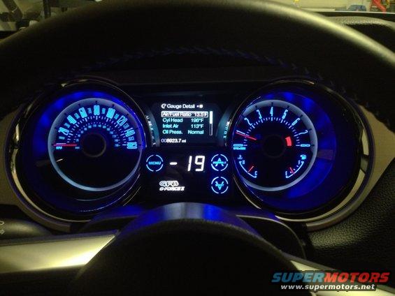 2013 Ford Mustang dashboard with blue illuminated gauges showing 80,237 miles and digital readouts for engine temperature and oil pressure