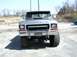 1979 Ford Bronco - A lifted 1978 Ford Bronco is parked on asphalt, facing the camera with a brush guard on its front bumper.