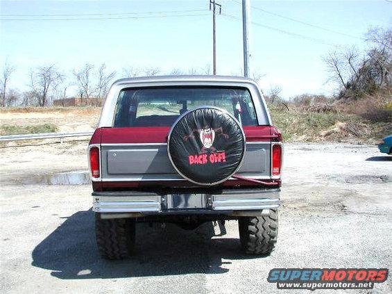 Rear view of a 1979 Ford Bronco with a spare tire cover reading "BACK OFF!"
