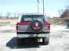 1979 Ford Bronco - This 1979 Ford Bronco is shown from the rear, a spare tire cover with a "BACK OFF!" message.