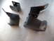 1993 Mazda MX-3 - Set of four metal seat mount brackets, showing wear and rust.