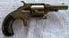 1968 Mercury Cougar - This is a close-up view of an antique revolver, showing its metallic finish and worn wooden grip.