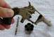 1968 Mercury Cougar - Disassembled revolver parts laid out on a white towel.