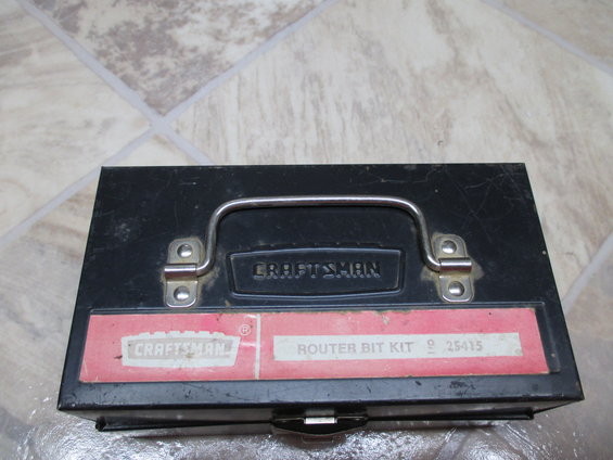 Black metal Craftsman router bit kit box with red label. Label says "CRAFTSMAN ROUTER BIT KIT 9 25415"