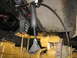 1989 Chevrolet C/K Pickup - Close-up view of a vehicle's rear axle and suspension components, including leaf springs and a shock absorber.