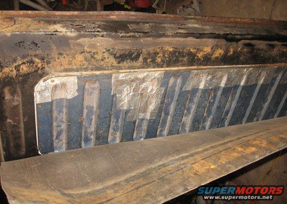 img_3149.jpg Original door insert with patched rust holes.