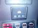 1989 BMW 3 Series - Close-up of car interior controls, including a garage door opener button and indicator lights for vehicle functions.