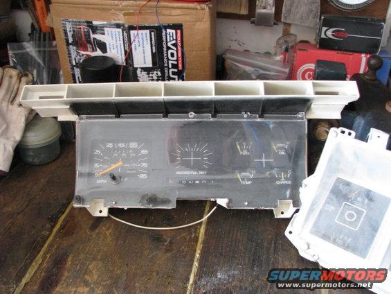 Instrument cluster with speedometer, fuel gauge, oil gauge, temperature gauge, and charge indicator