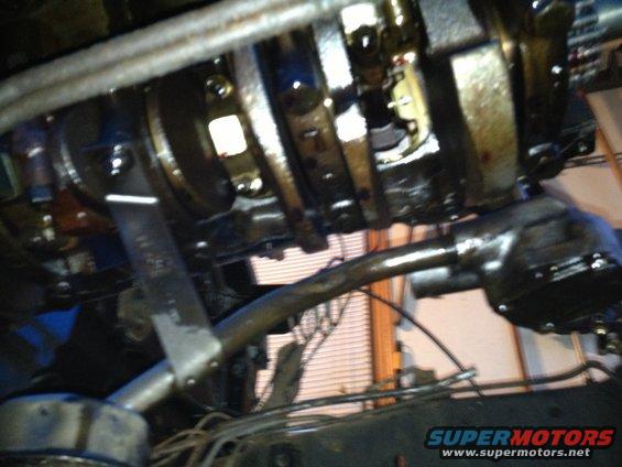 Engine crankshaft and connecting rods, oily, viewed from below