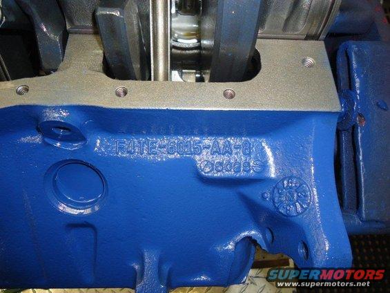 Blue painted engine block with part number F4TE-6015-AA-8 stamped on it