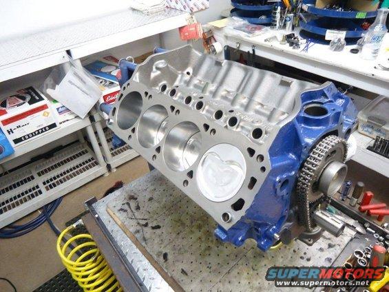 Blue engine block with pistons and timing chain