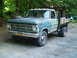 1979 Ford Bronco - This Ford F-Series truck features a flatbed and dual rear wheels, with a grille indicative of a 1967 model year.