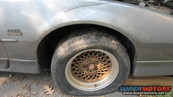 Close-up of a 1987 Pontiac Trans Am GTA fender and wheel