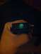 1989 BMW 3 Series - A hand holds a car's interior light switch, which has a glowing icon illuminated.