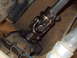 1986 Ford Bronco II - Close-up of a steering shaft universal joint, showing metal components and fasteners.
