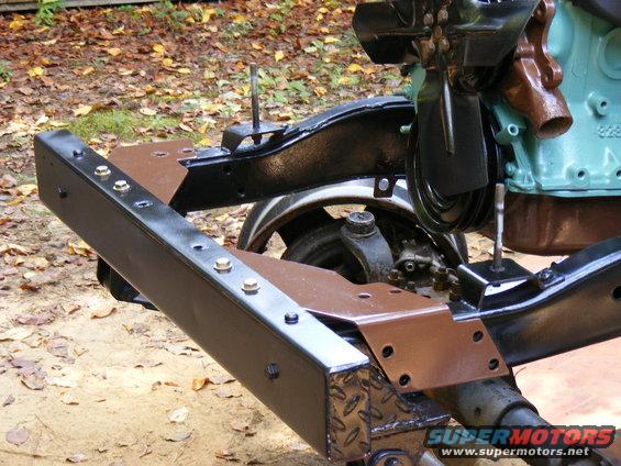 Vehicle frame with engine components, including fan and belts