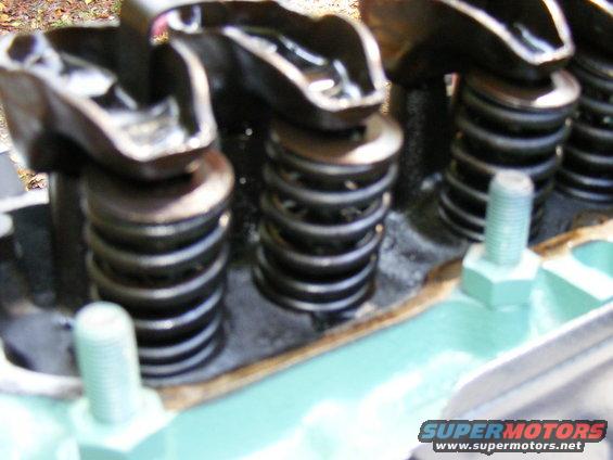 Engine valve train with springs and rockers, close-up view