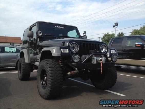 Black Jeep Wrangler with KC lights and winch