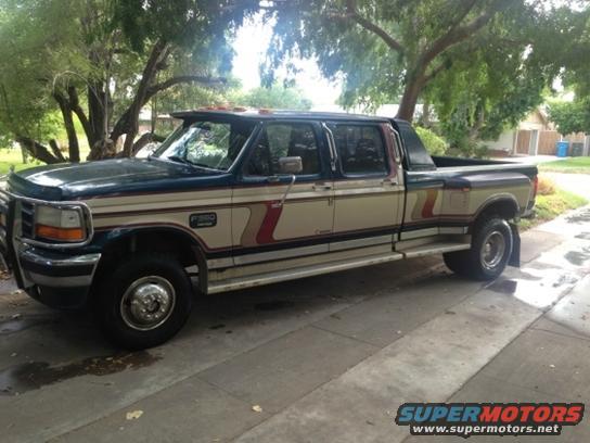 Ford F-350 crew cab dually pickup truck, tan and dark green two-tone paint with stripes