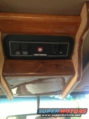 Interior control panel with switches for fog and driving lights, labeled CENTURION, and aux power