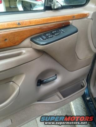 Interior door panel with wood trim and power window controls