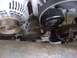 1994 Ford Bronco - Close-up view of engine belt tensioner and pulleys.