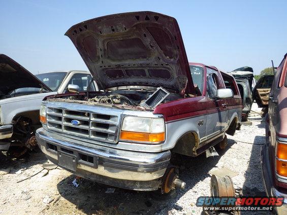 96brxlta.jpg 96 Bronco XLT 5.8L E4OD

The only useful parts I found on this catastrophe were the hard splash guards, but the LHF one was missing.

http://www.etis.ford.com/vehicleSelection.do#
Build Date:	  27.11.1995
Body Style:	  Double Cab (3/4 Door)
Version:	  150
Engine:	  5.8L OHV EFI V8 (NP)
Transmission:	  E4OD(4R100)
Drive:	  RHD RWD
Axle Ratio:	  3.55
Emission:	  With 49 State Emission Requirements
Air Conditioning:	  Manual Air Conditioning
Paint:	  Silver Frost
 Medium Opal Grey
 XLT
 Michigan Plant Built
 With Power Equipment Group
 With Privacy Glass
 With Heated Rear Window
 With Full Floor Console
 With Drivers Power Mirror
 With Passenger Power Convex Mirror
 With Heavy Duty Trailer Towing
 Double Cab (3/4 Door)
 With Body Tu-Tone Paint
 With Front License Plate Bracket
 With Exterior Tire Carrier
 7.5J x 15 Deep Dish Wheel
 With Super Engine Cooling System
 With Handling Package
 3.55
 Less Rear Axle Limited Slip Diff
 5.8L OHV EFI V8 (NP)
 Electric Trans Case And Auto Hubs
 With Tilt Steering Wheel
 With Tachometer
 Heavy Duty Battery
 Elect AM/FM/Stereo/Cassette/Clock
 With NAAO Radio Frequency
 With Light Group
 Dark Toreador
 Silver Frost