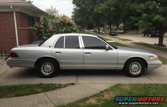 1995 Mercury Grand Marquis parked on a suburban driveway