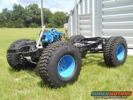 Chassis with large tires and blue engine, viewed from the side