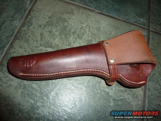 Brown leather axe sheath with embossed logo on the side