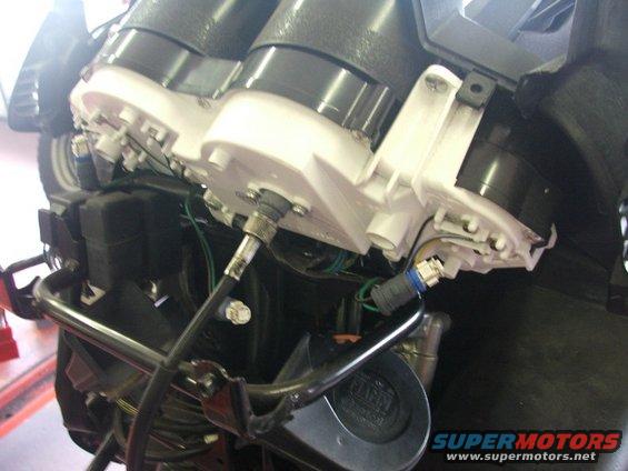 Close-up of motorcycle instrument cluster wiring and components