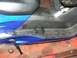 2006 Honda Reflex - Close-up view of a blue scooter's floorboard, showing textured grip and footrest mounts.