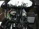 2006 Honda Reflex - The front of a motorcycle is disassembled, revealing its internal wiring and horn components.