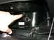 2006 Honda Reflex - A finger points to an open power outlet above a cigarette lighter socket in a vehicle's interior.