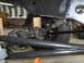 1992 Ford Bronco - Close-up view of the undercarriage and suspension components of a vehicle.